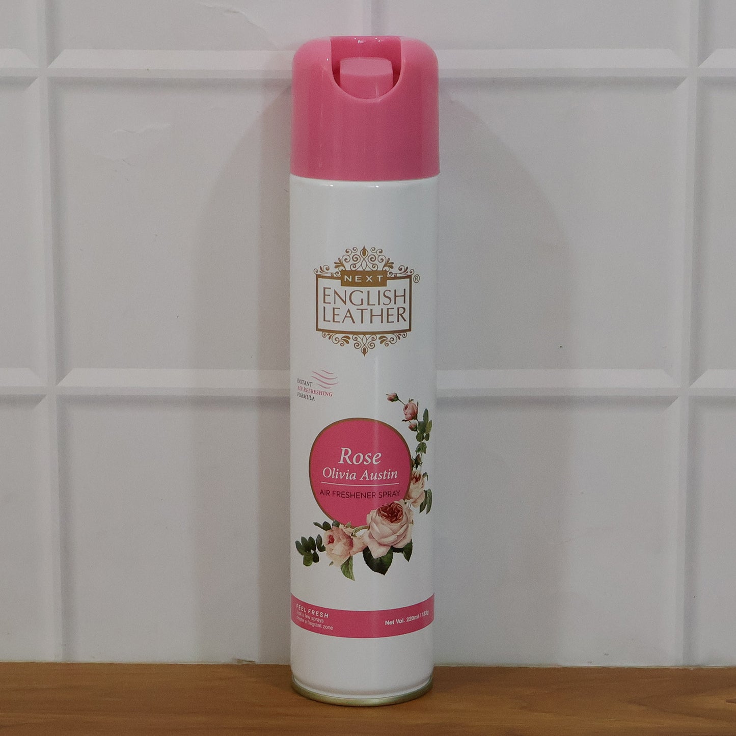 Next Premium English Leather Rose air freshener spray by Wukusy, 220 ml bottle with a sleek design and floral scent.
