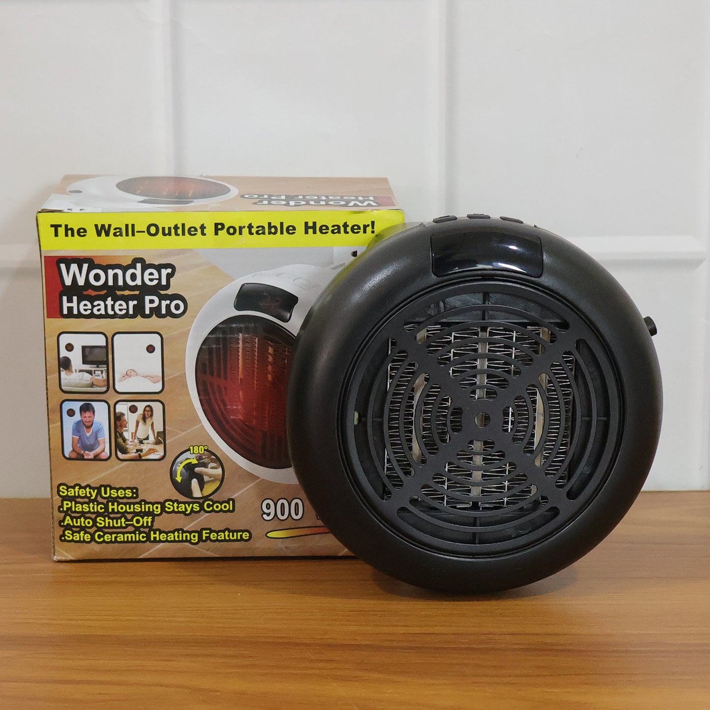 Wukusy portable wall outlet electric room heater 900W, compact design with visible power cord and wall attachment for efficient heating.
