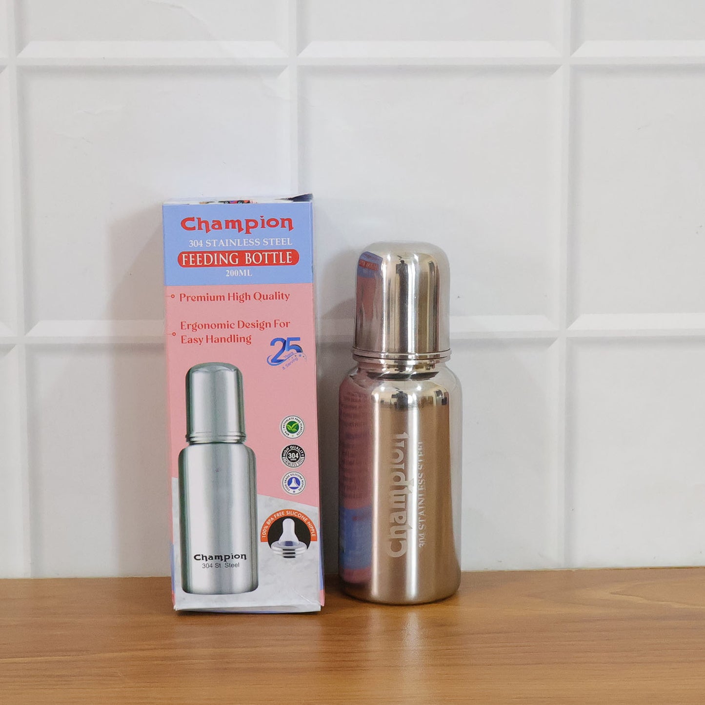 Stainless steel baby feeding bottle by Wukusy, 200ml capacity, with a clear silicone nipple and metallic finish.