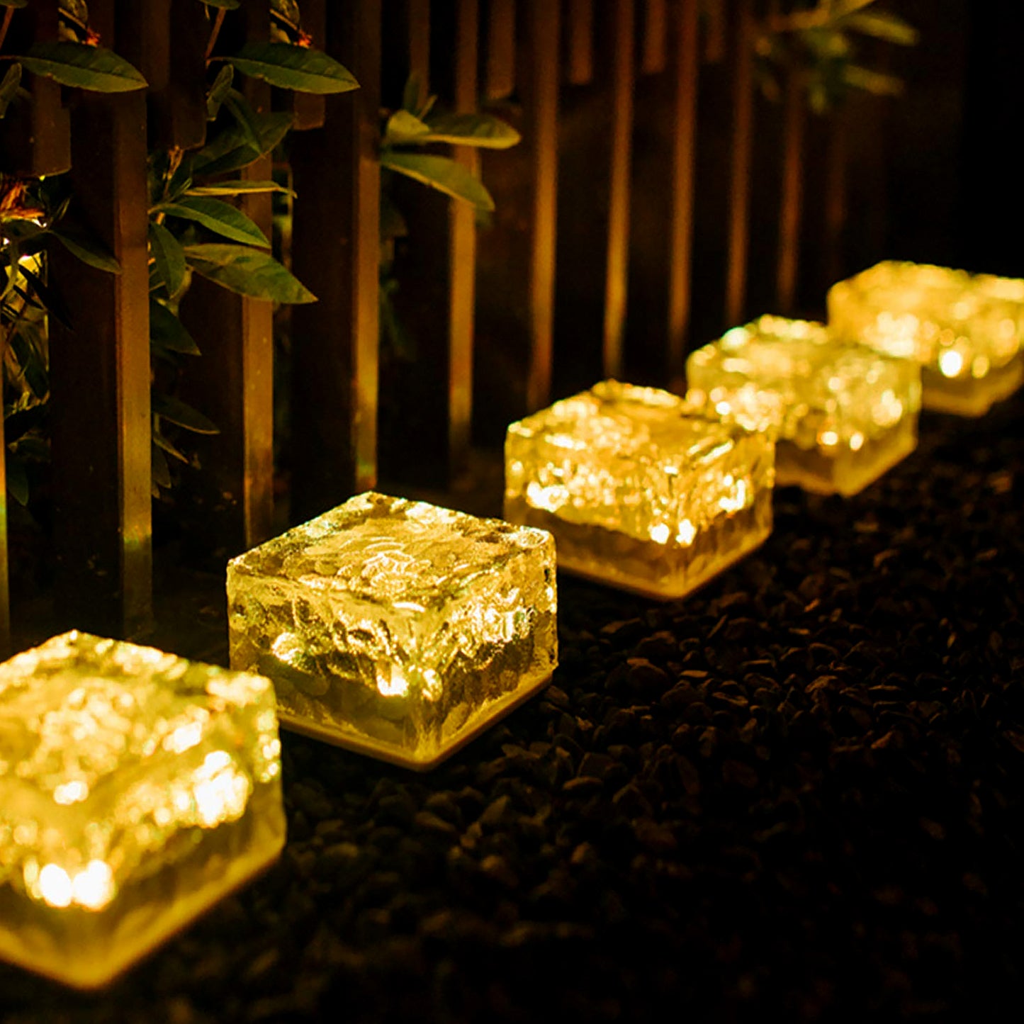 Wukusy Ice Cube Shaped Solar Garden Light emitting warm light, outdoor decorative light for walkways, pathways, and backyard decor.