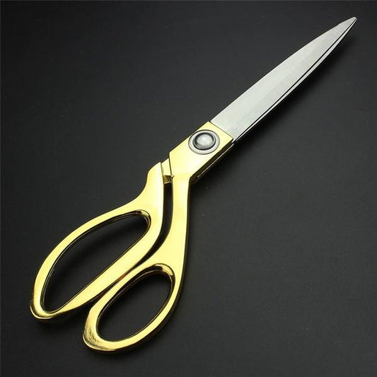 Gold plated Wukusy professional cloth cutting scissor for home improvement, featuring sharp blades and ergonomic handle.