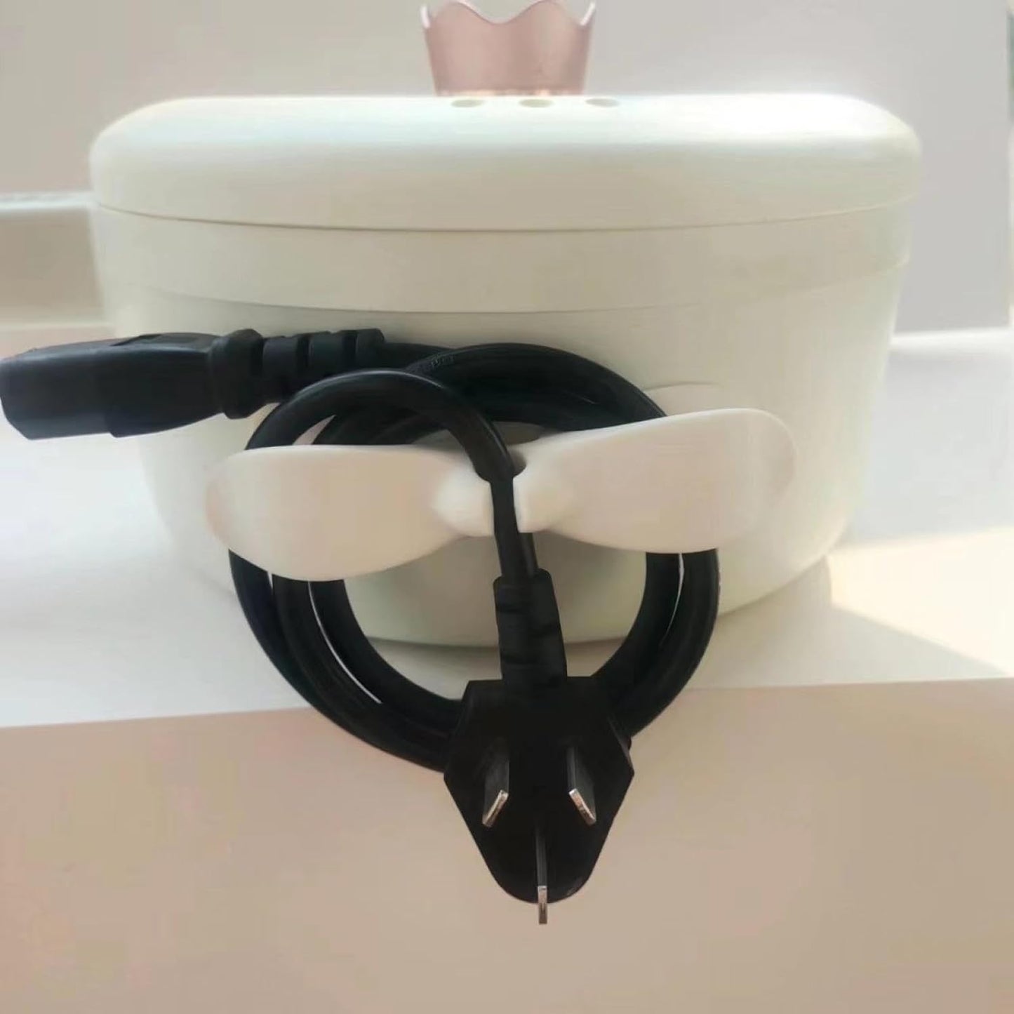 Wukusy power plug holder organizer for appliances, adhesive cord winder and wire wrap for coffee makers and pressure cookers.