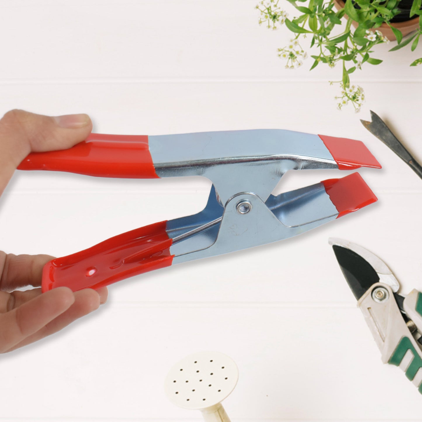 Two Wukusy 4-inch heavy-duty metal spring clamps for home improvement projects, shown in a set of two with open jaws.