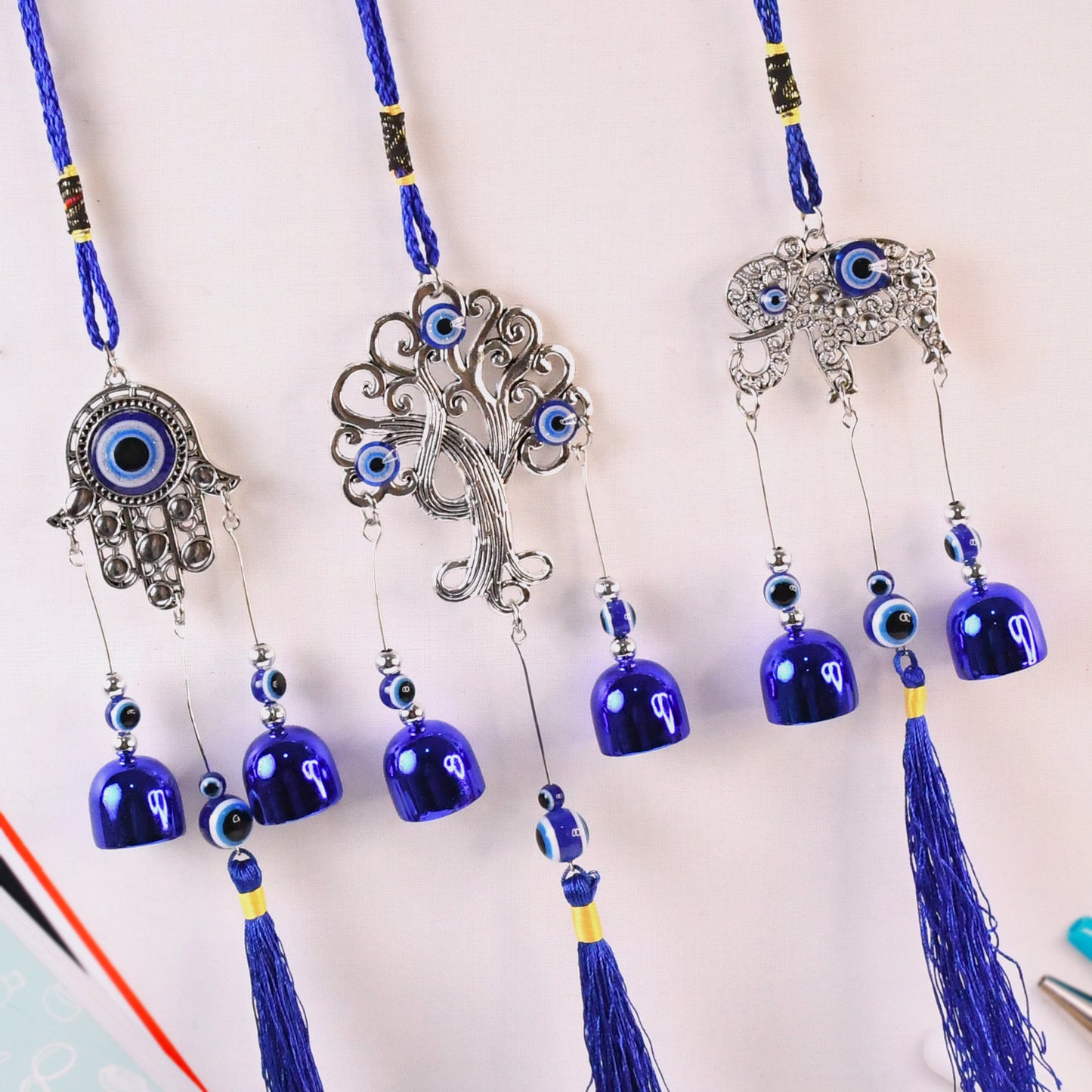 Metal Evil Eye Wind Chime Bells by Wukusy, decorative home improvement piece with mixed design, hanging chime with evil eye motif.