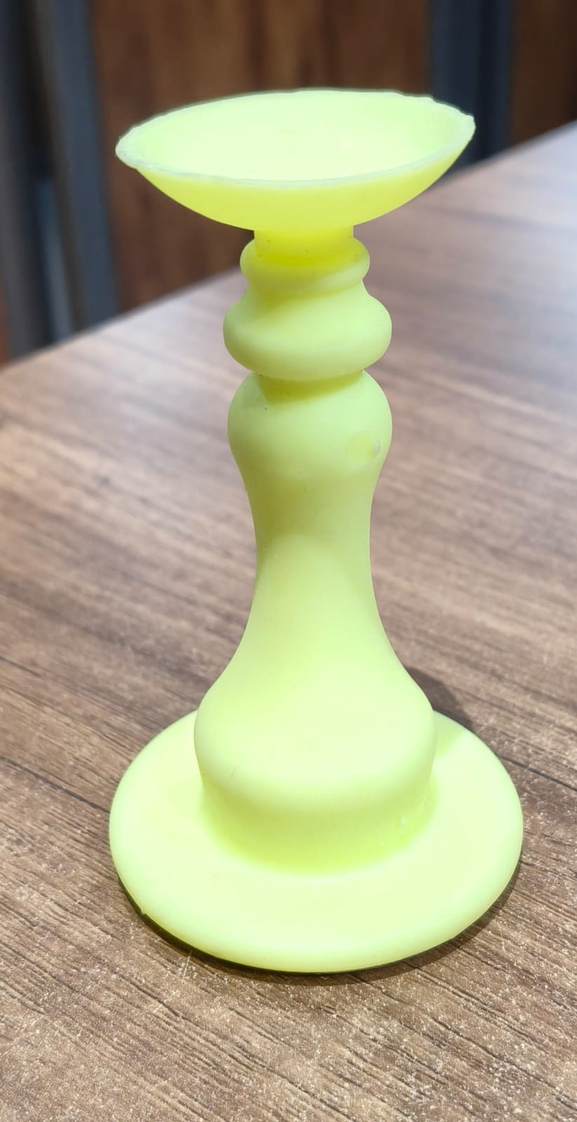 Neon yellow washing machine door holder and stopper by Wukusy, designed to keep the washing machine door open.