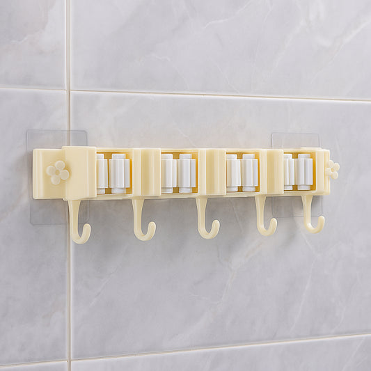 Wukusy self-adhesive wall-mount broom and mop holder rack for organizing cleaning tools in home improvement spaces.