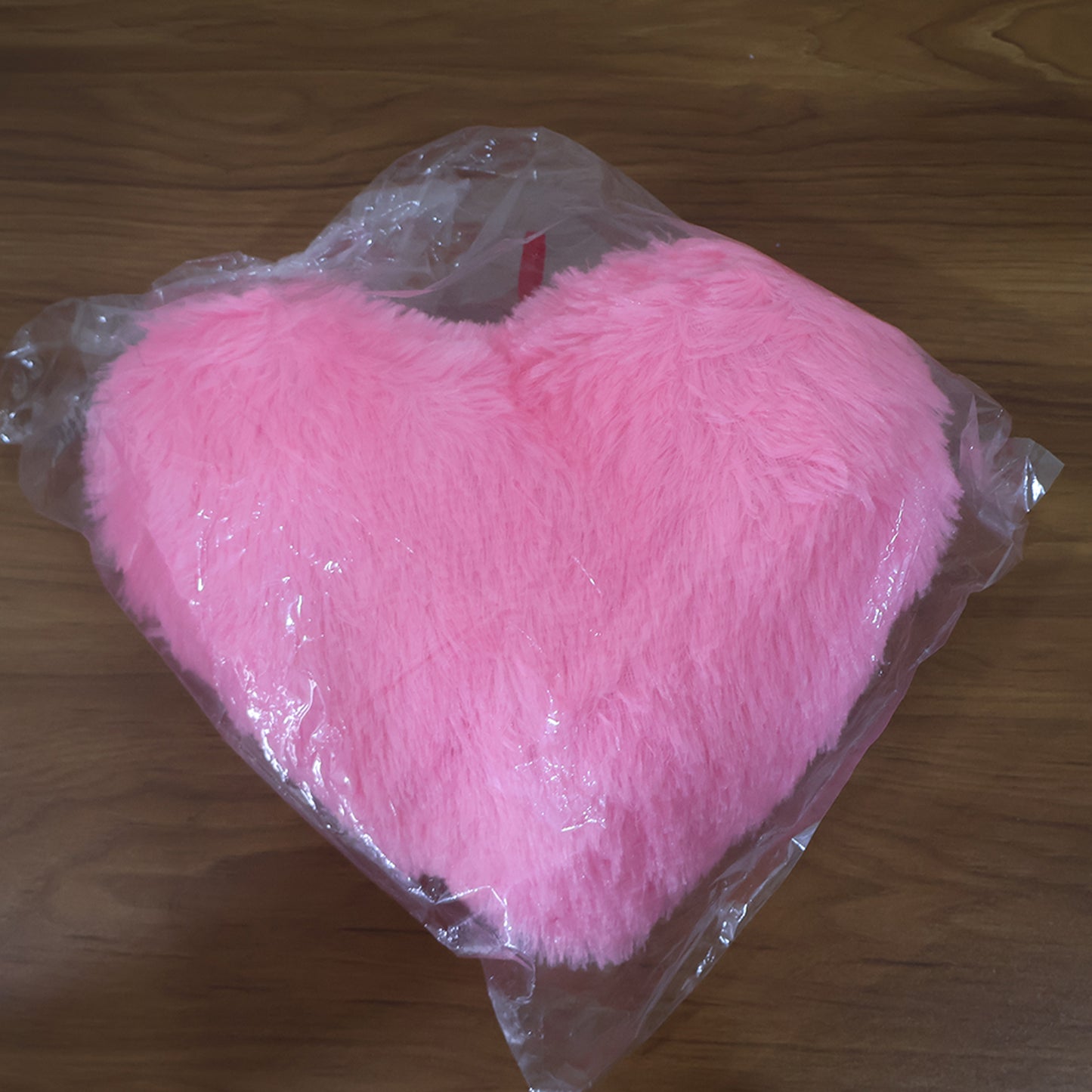 Soft plush heart-shaped cushion from Wukusy with "I Love You" embroidery, perfect for home decor or comfort.