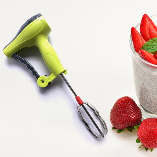 Wukusy Power Free Manual Hand Blender with stainless steel blades for milk lassi, egg beating, and mixing in a home kitchen setting.
