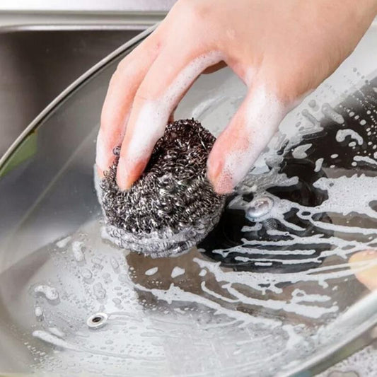 Set of 12 Wukusy stainless steel round ball scrubbers for kitchen cleaning, durable and effective for scrubbing pots and pans.