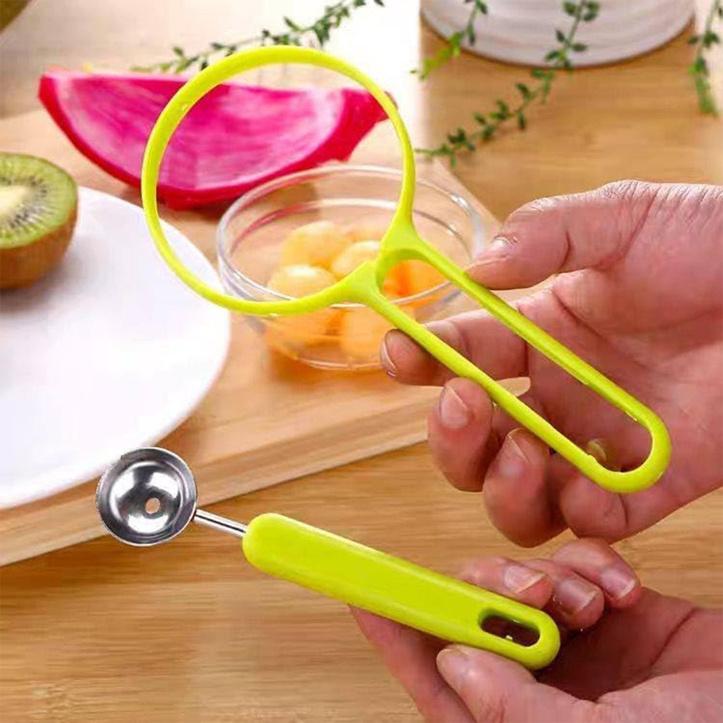 Wukusy 2-in-1 kitchen tool with soft fruit peeler and baller for avocados, papayas, watermelons, and honey dew in a single gadget.
