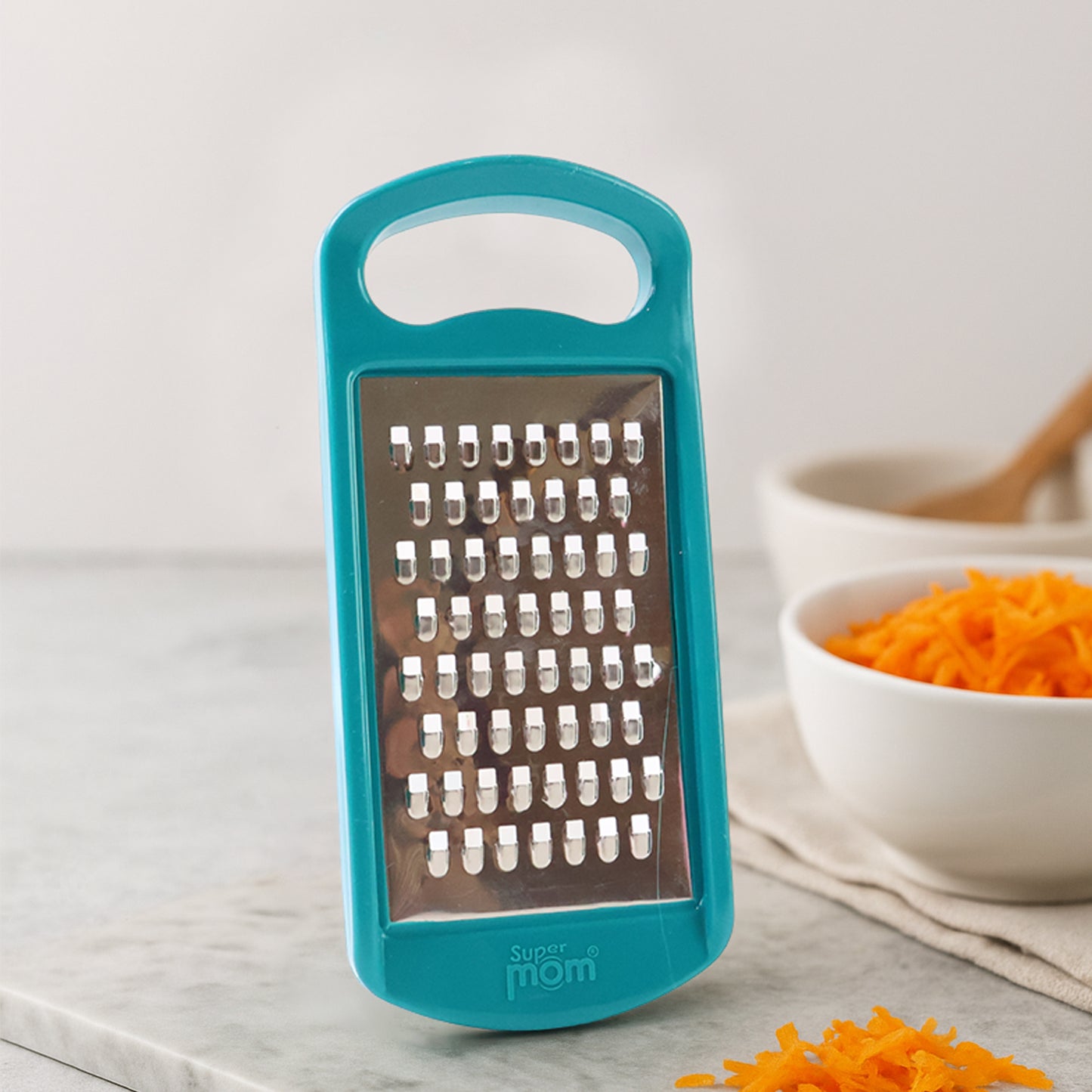 Wukusy multipurpose cheese and vegetable grater, kitchen tool with multiple grating surfaces for cheese, vegetables, and more.