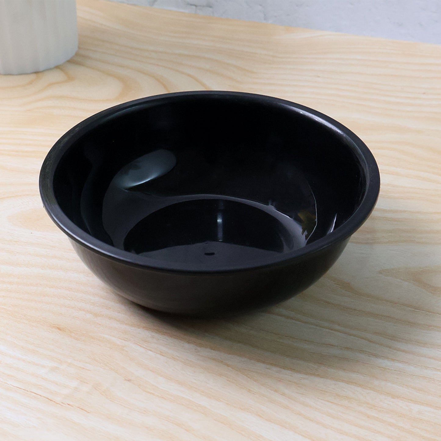 Black plastic 6-inch round deep serving bowl from Wukusy for home and kitchen use, shown on a white background.
