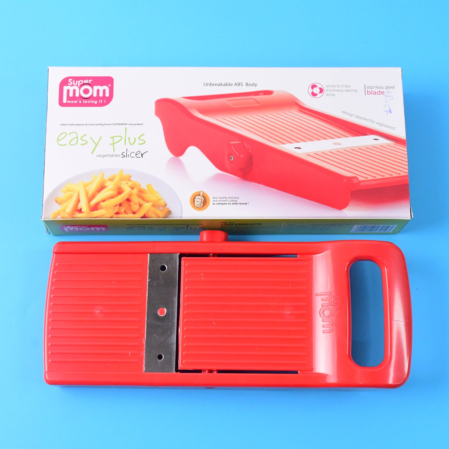Wukusy Supermom Easy Plus vegetable slicer for home and kitchen, showing the compact handheld kitchen tool in use.