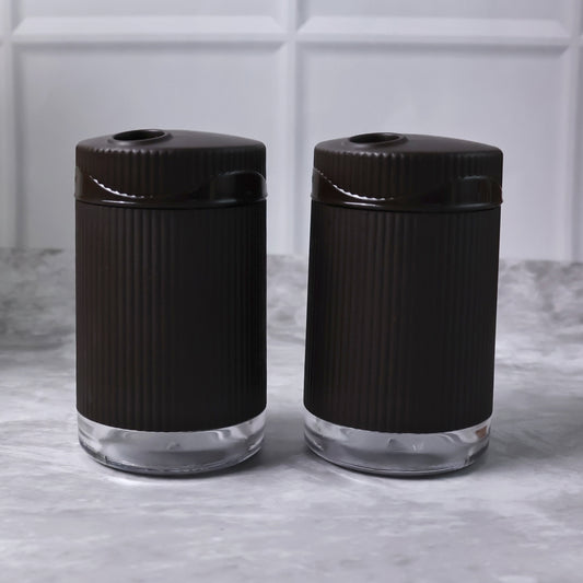 Wukusy Supermom Linoo salt and pepper dispenser set, 2-piece kitchen condiment shakers with clear glass and black caps.