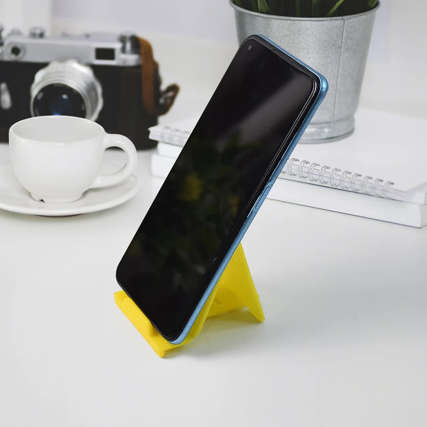Six Wukusy adjustable foldable plastic mobile phone stands in mixed colors, perfect for hands-free viewing and easy portability.