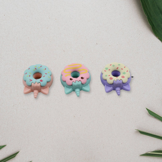 Set of three small cartoon-themed donut erasers by Wukusy, non-toxic school stationery for kids, boys, and girls.