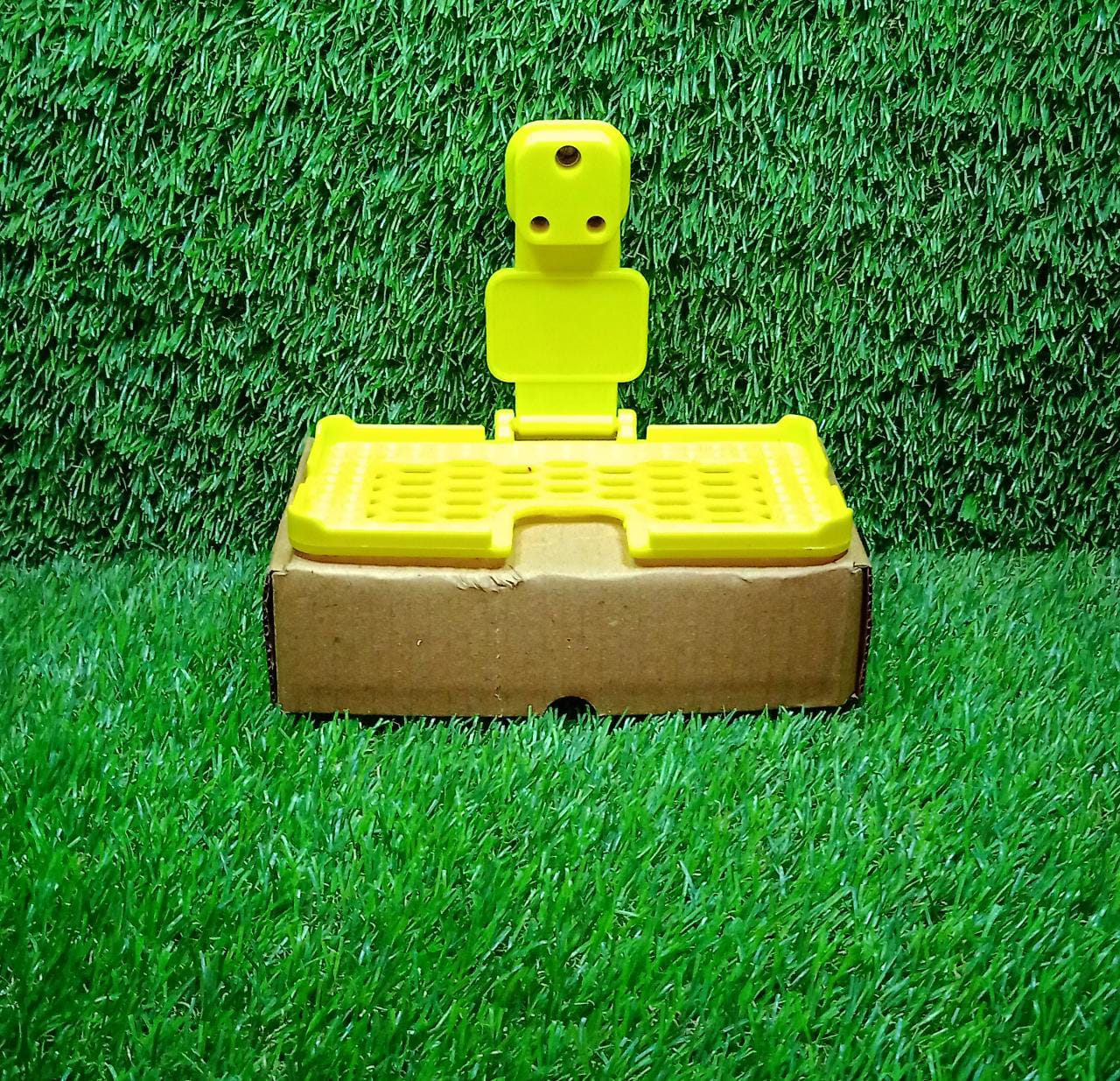 Wukusy 6498 multi-purpose yellow wall holder stand for mobile charging, designed to fit in socket and hang devices securely