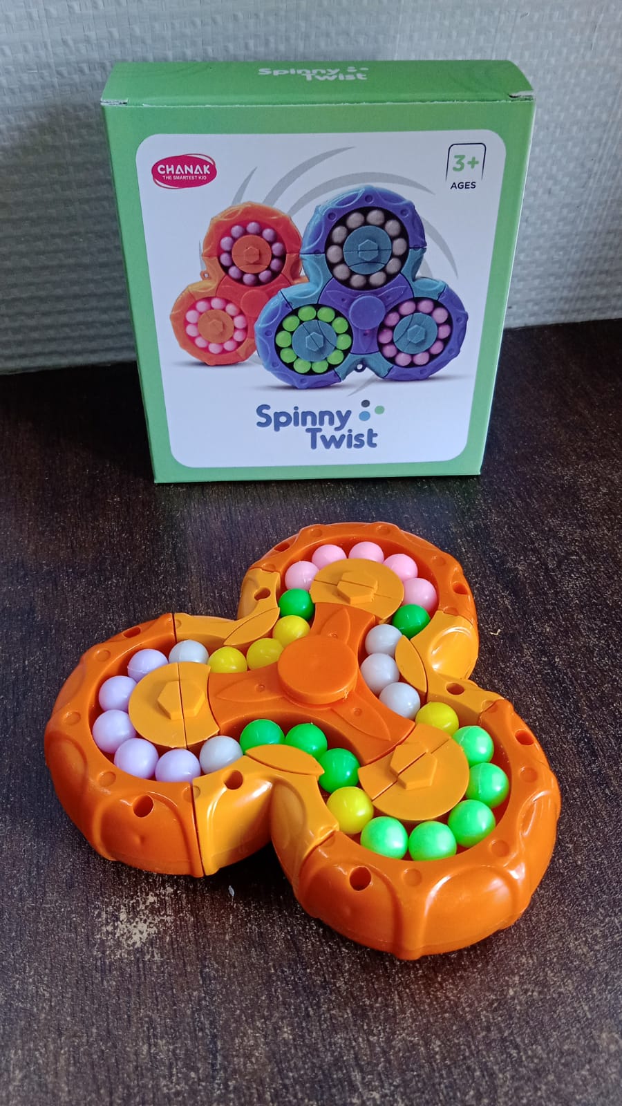 Wukusy Aditi 3-in-1 interactive spinny twist puzzle ball toy for children with colorful, engaging design and multiple play features.