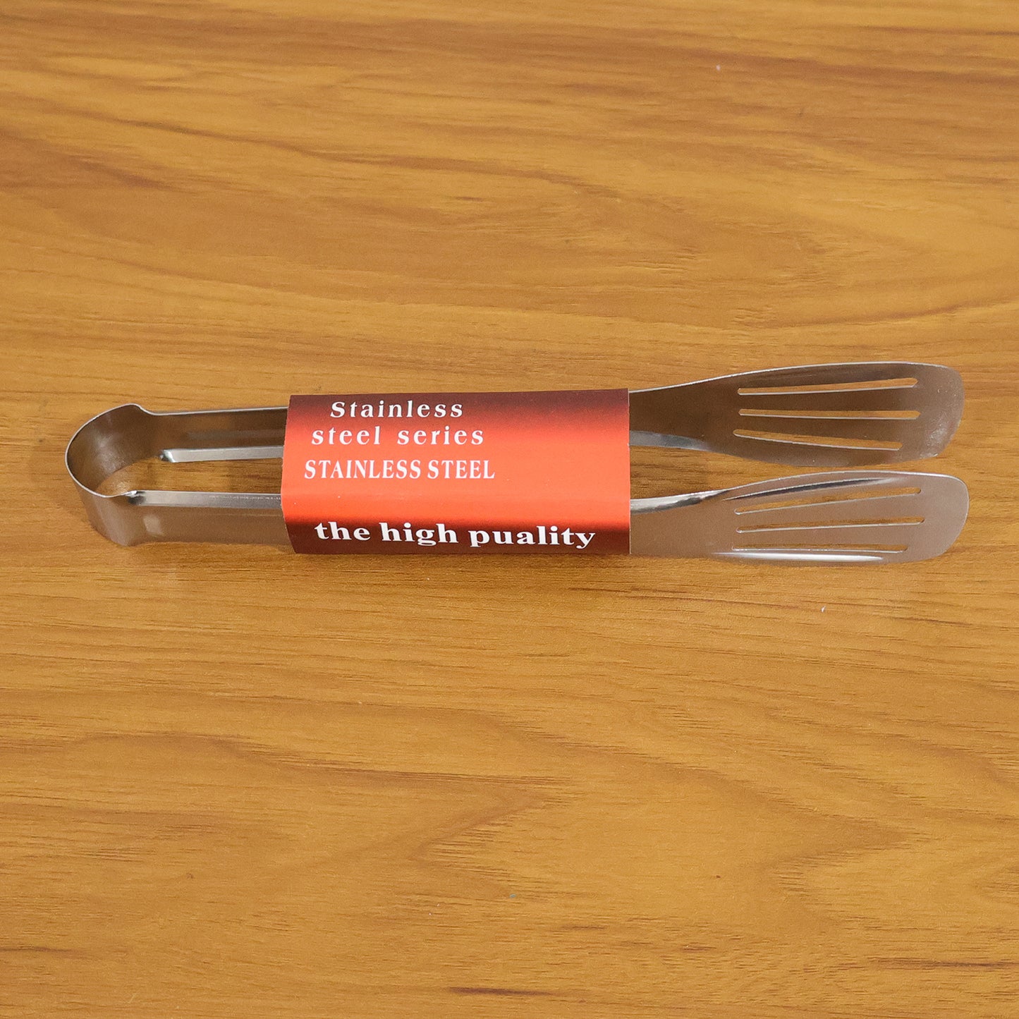 Stainless steel kitchen serving tongs by Wukusy, 1 piece, with a shiny finish and ergonomic handle for easy food serving.