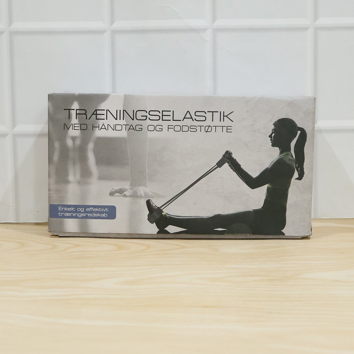 Wukusy portable resistance exerciser with pull rope and foot pedal support for strength training and flexibility workouts.