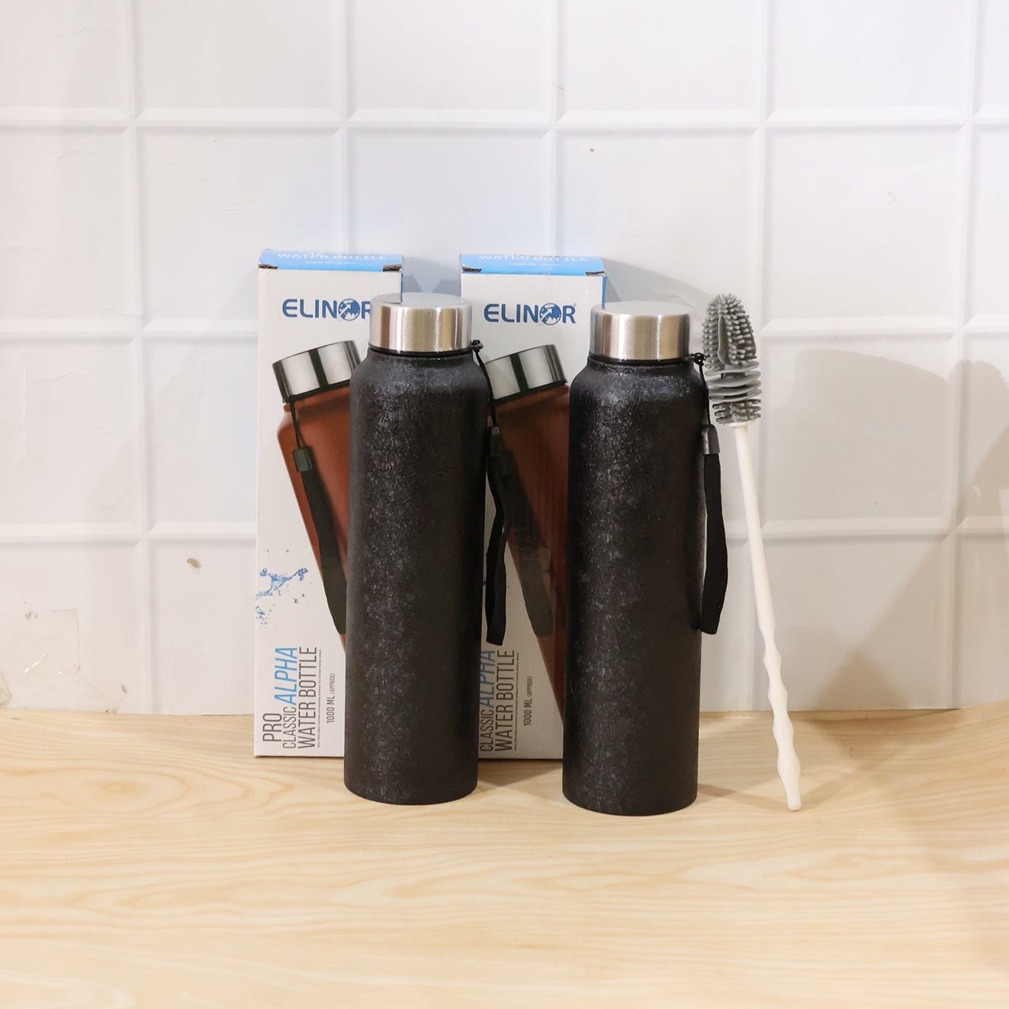 Stainless steel Wukusy water bottle with free cleaning brush, shown with sleek design and secure lid on a white background.