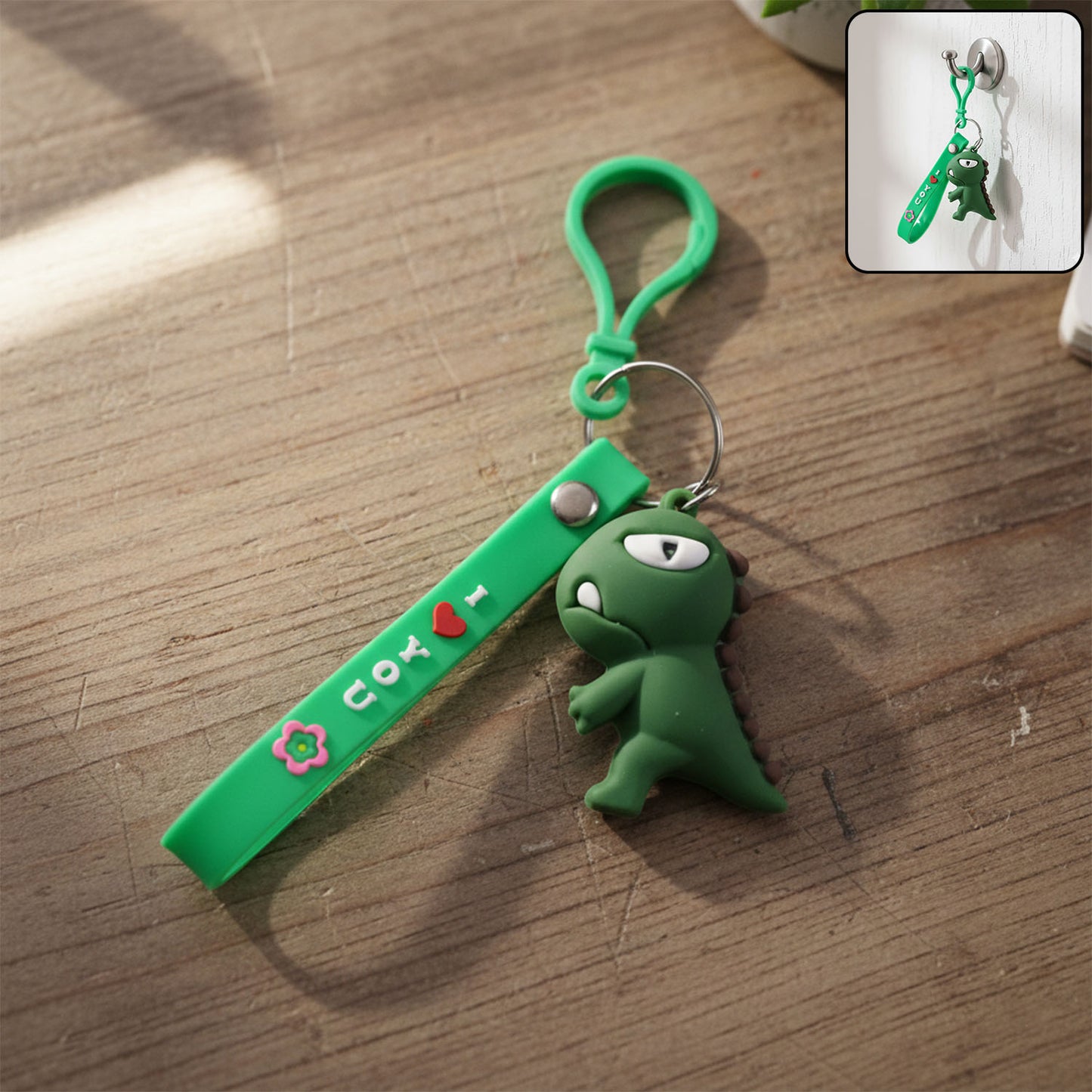 Cute dinosaur cartoon silicone keychain by Wukusy, featuring a colorful, playful dinosaur design on a durable silicone keyring.