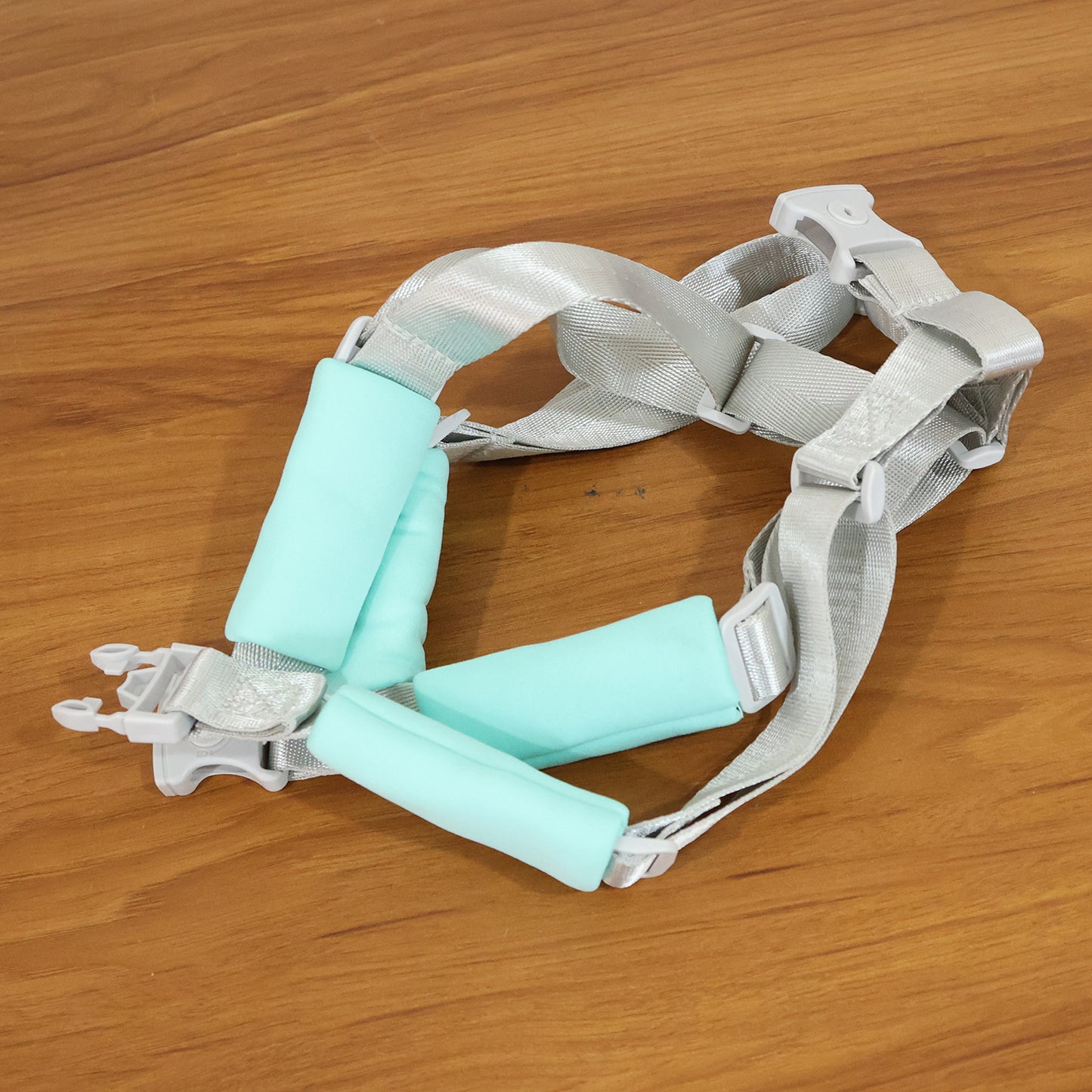 Adjustable Wukusy baby safety harness support belt with padded straps, designed to keep infants secure and comfortable.