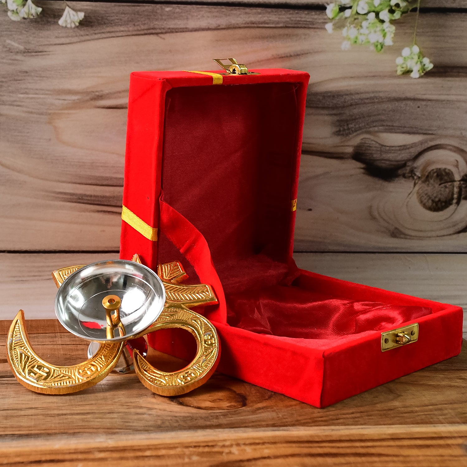 Brass Om symbol oil diya for home decor, featuring a carved Om design and a small oil reservoir, by Wukusy.