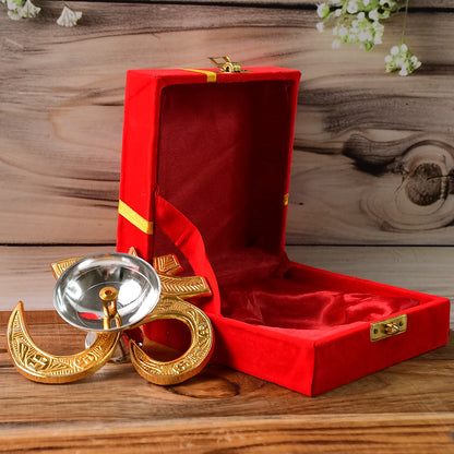 Brass Om symbol oil diya for home decor, featuring a carved Om design and a small oil reservoir, by Wukusy.