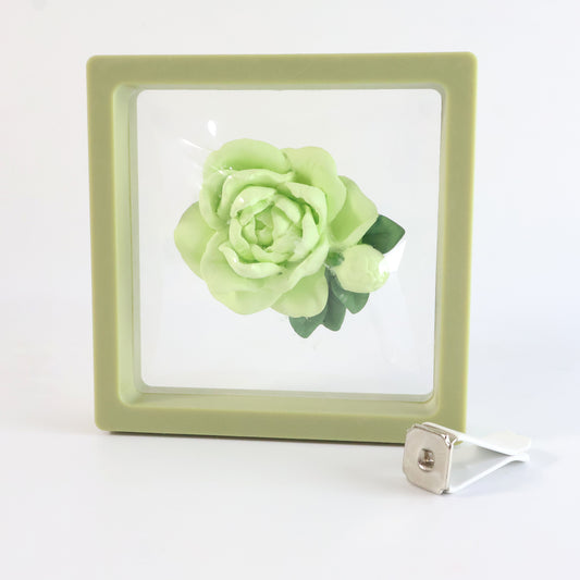 Wukusy elegant rose flower car air freshener clip with 10ml perfume bottle attached to an ac vent, showcasing a floral design.