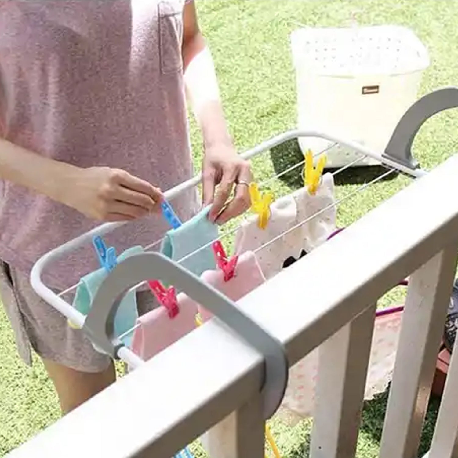 Wukusy metal steel folding drying rack with multiple bars for clothes, towels, and socks, suitable for indoor or outdoor laundry use.