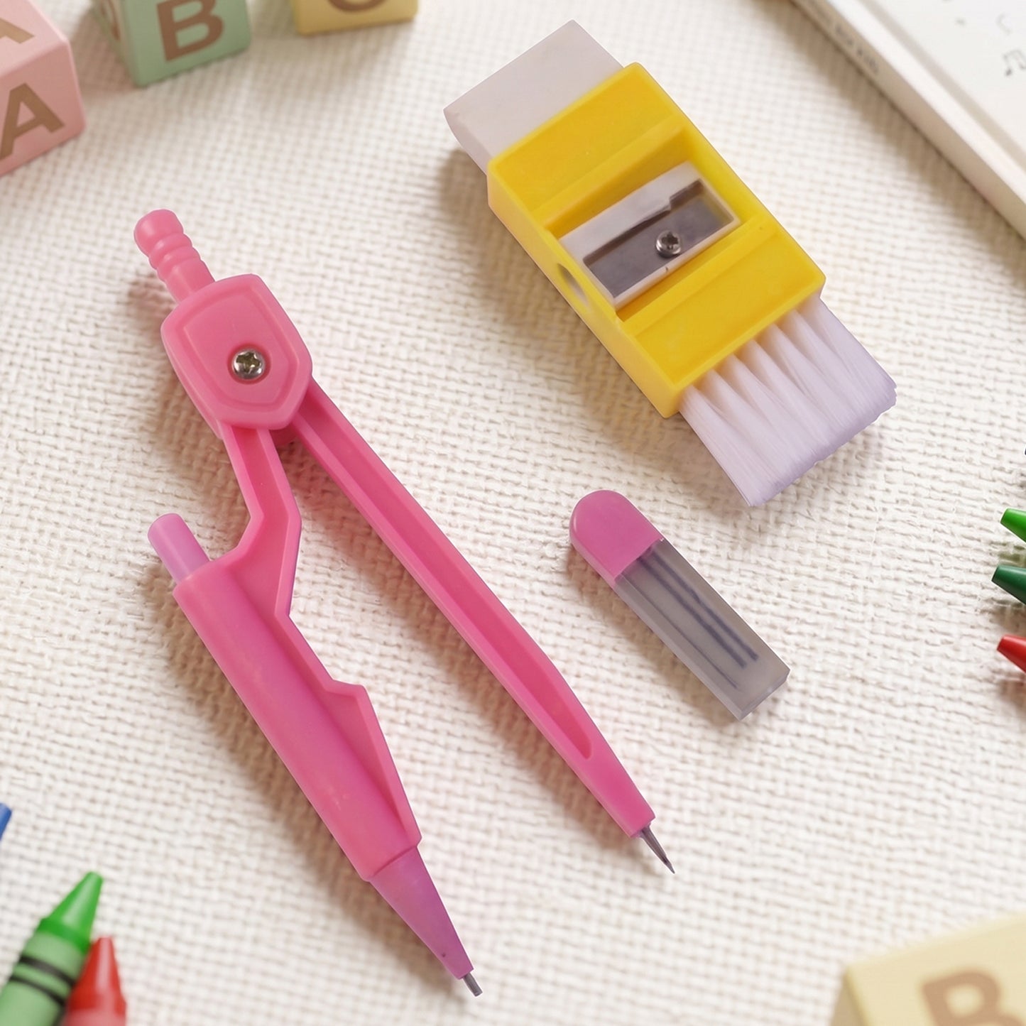 Kids Wukusy mini stationery set with colorful pens, pencils, and erasers for creative school activities.