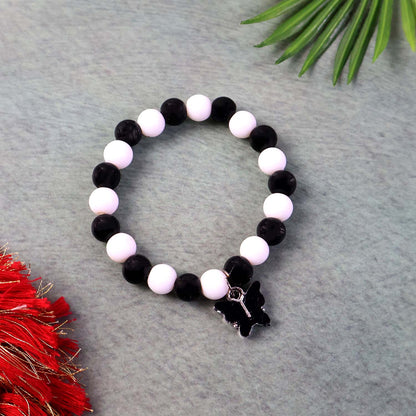 Elegant black and white fancy bracelet by Wukusy featuring intricate design and stylish appearance on a neutral background.