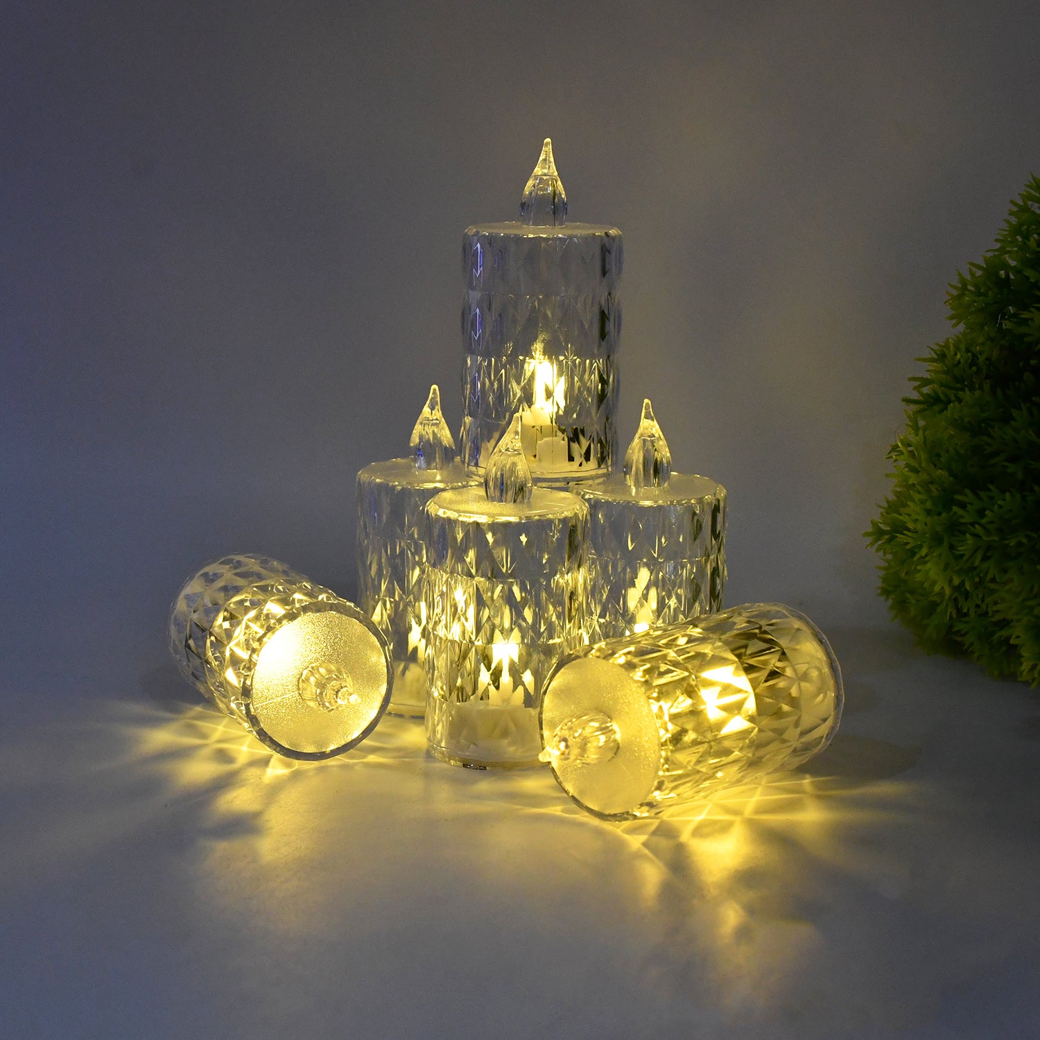 Wukusy LED crystal effect flameless candle light set with five elegant gold candles and realistic flickering flames.