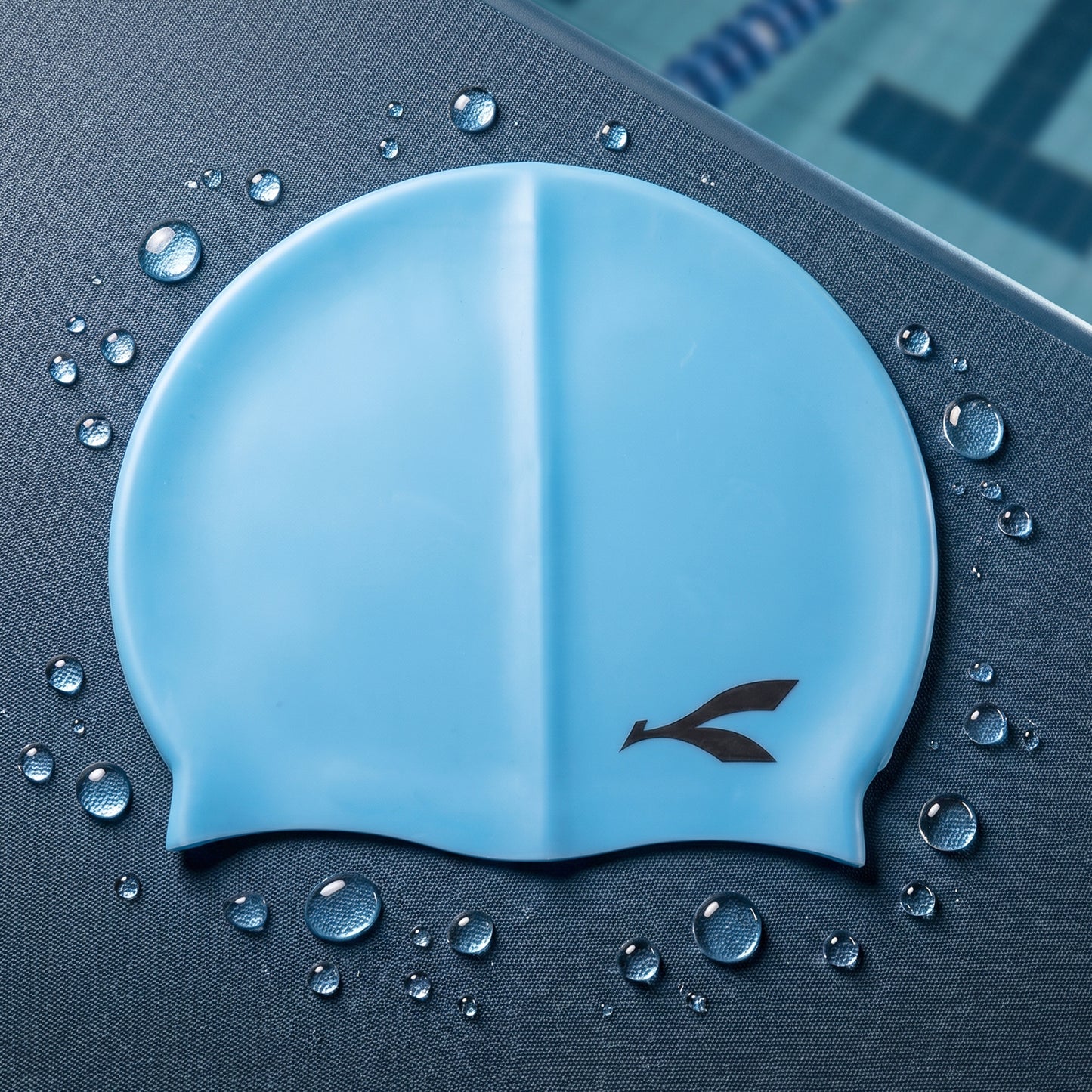 Wukusy waterproof stretchable silicone swimming cap shown on a model's head, designed for comfortable, snug fit during swimming.