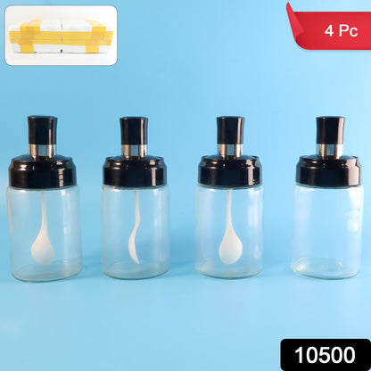 Set of four transparent spice jars with airtight lids and spoons by Wukusy for kitchen storage and spice organization.