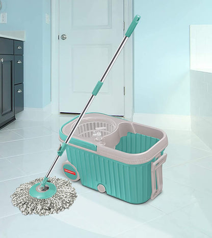 Wukusy 8703 Spin Mop with large wheels and plastic auto-fold handle for 360-degree cleaning, shown in a clean, modern home setting.