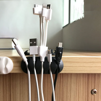Wukusy 1334 Cable Clips for organizing wires and cables on desks and tables, versatile wire holder for mobile accessories.