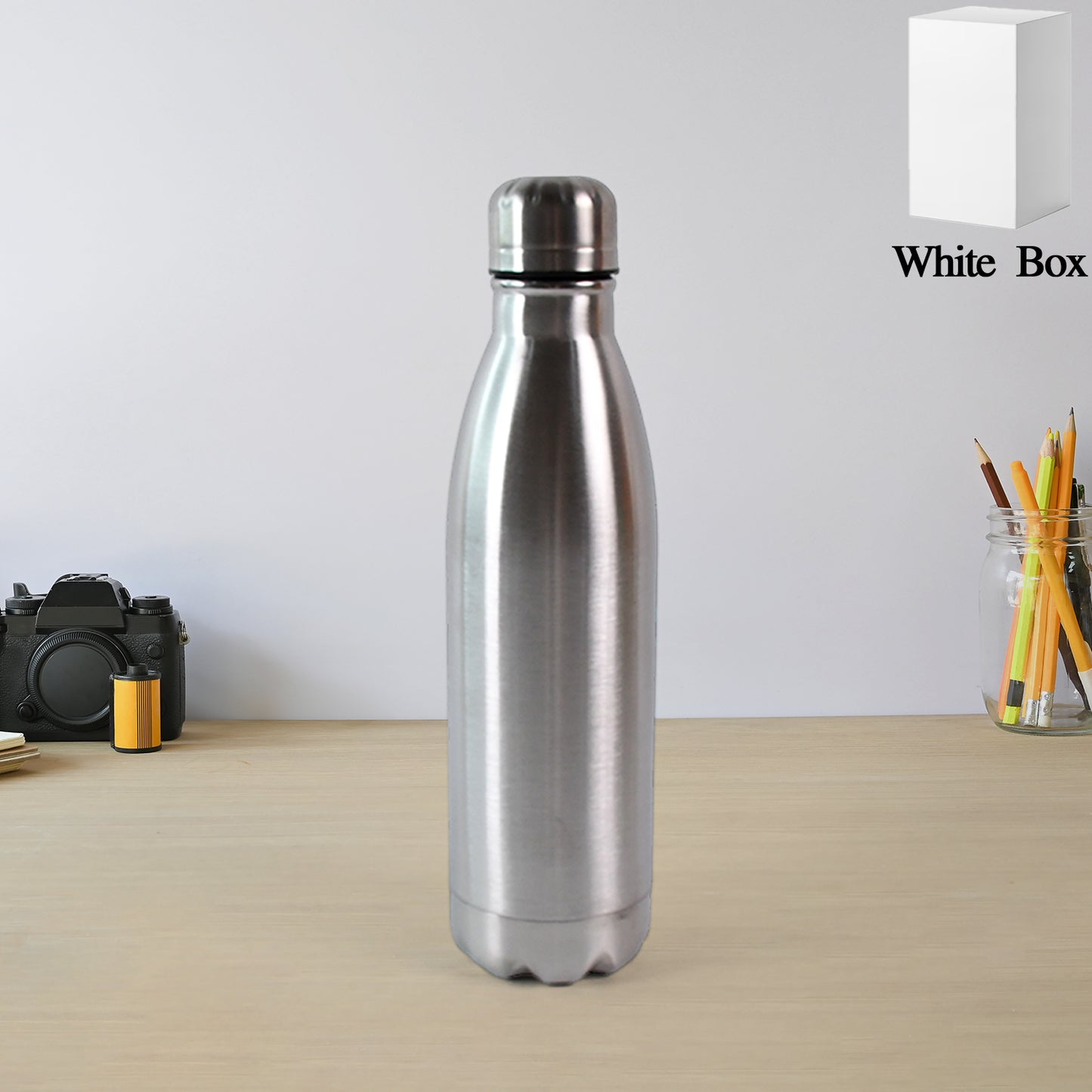 Silver stainless steel water bottle, 500ml capacity, with Wukusy branding, featuring a sleek, durable design for everyday use.