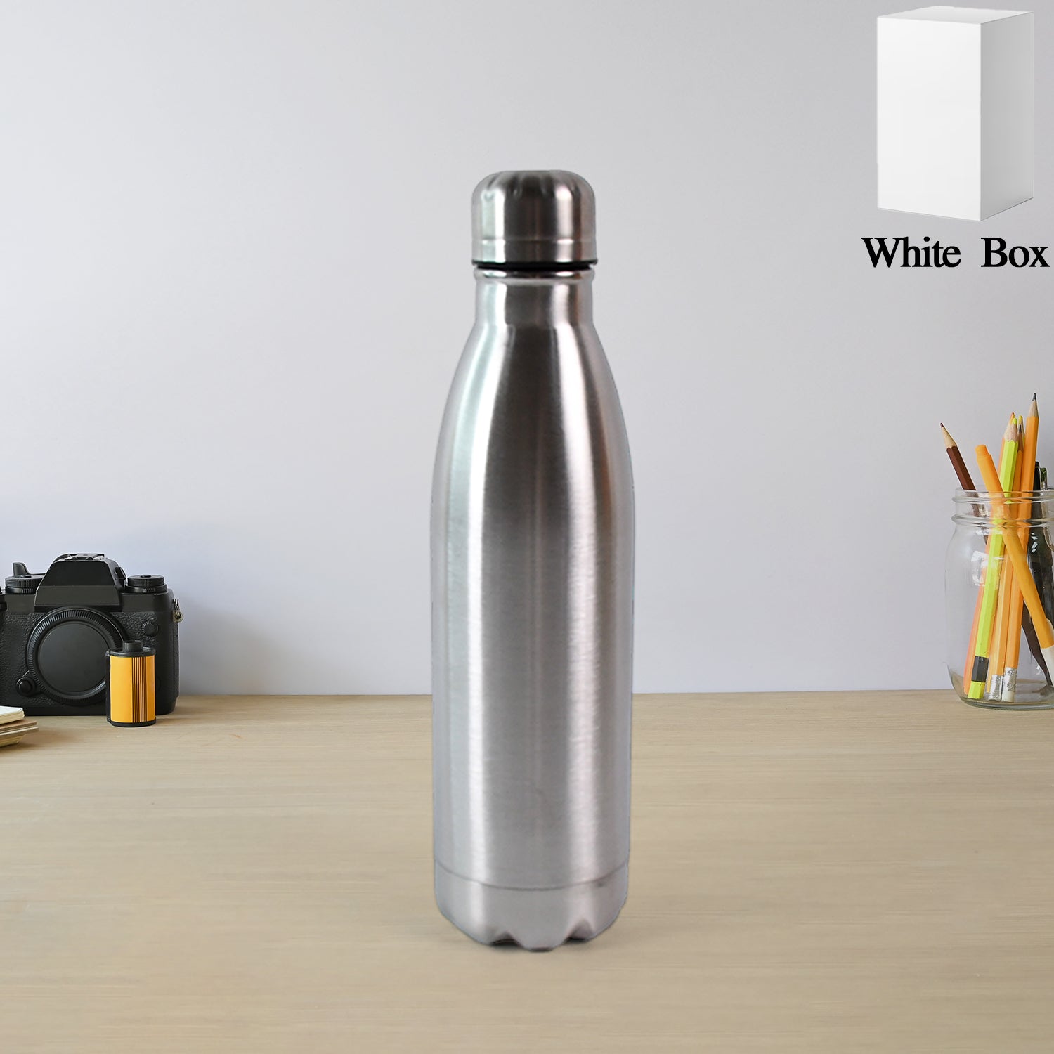 Silver stainless steel water bottle, 500ml capacity, with Wukusy branding, featuring a sleek, durable design for everyday use.