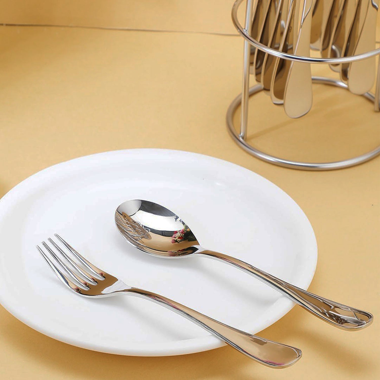 Wukusy Apex Premium Stainless Steel Cutlery 16-piece set including forks, knives, spoons, and teaspoons for home and kitchen use.