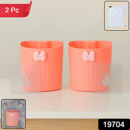 Two Wukusy wall-mounted toothbrush holders with butterfly design, made of durable material, ideal for bathroom organization.