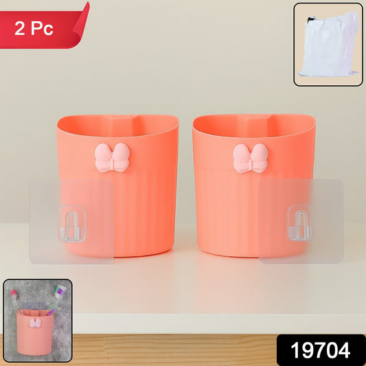 Two Wukusy wall-mounted toothbrush holders with butterfly design, made of durable material, ideal for bathroom organization.