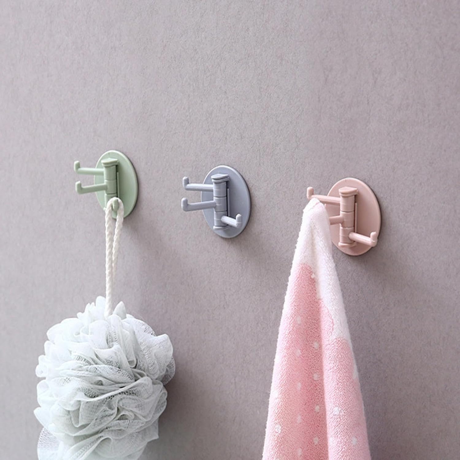 Wukusy 4142 sticky punch-free household hook with three rotatable hooks, suitable for bathroom, kitchen, and office use.