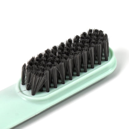Wukusy small cleaning brush for shoes and clothes, featuring soft bristles for gentle cleaning of fabric and footwear surfaces.