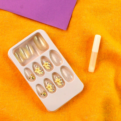 Wukusy premium glitter 3D floral press-on artificial nail tips set with nail glue, featuring sparkly floral designs and clear tips.