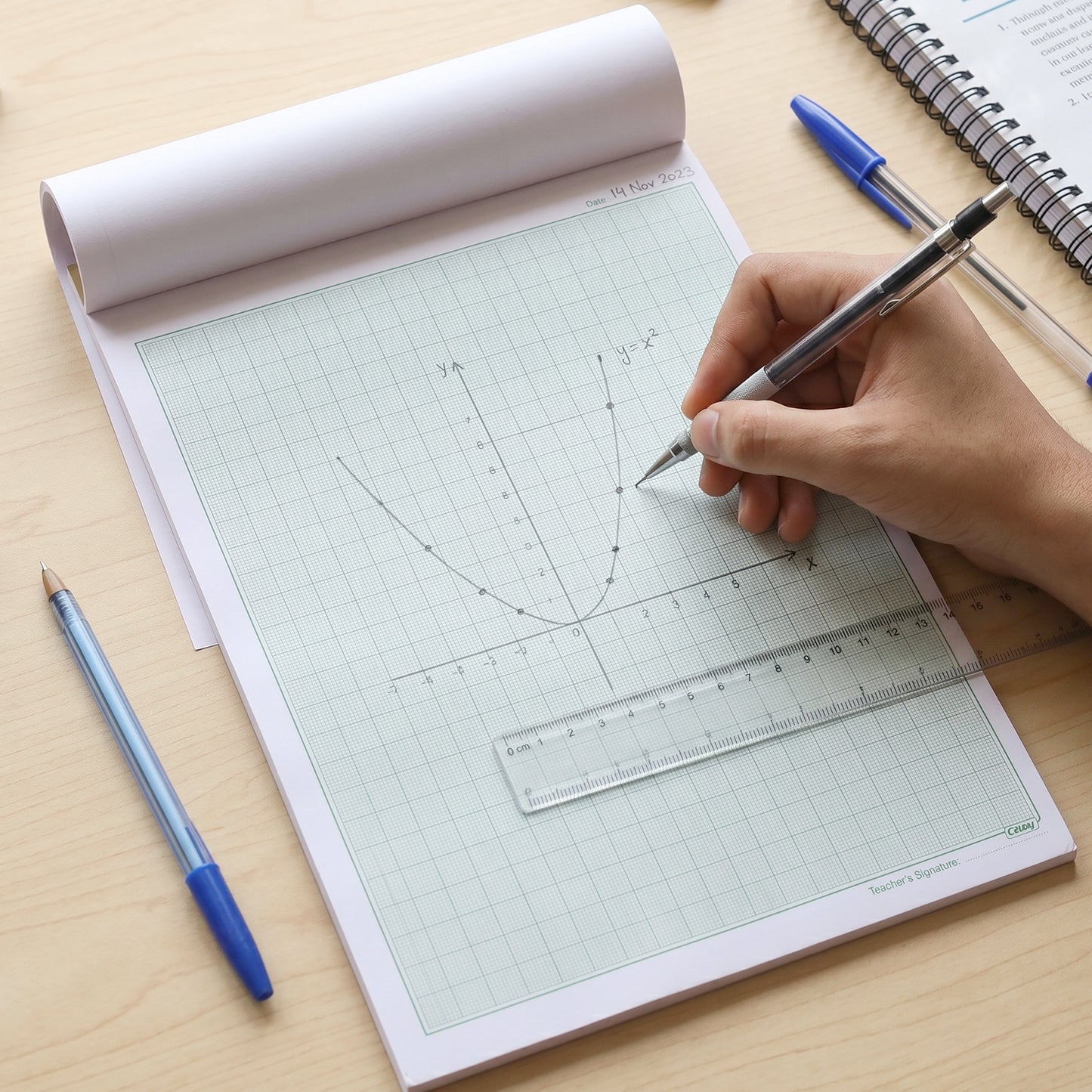 Wukusy Oddy A4 graph paper pad with 1mm square grid, 25 sheets, displaying neatly aligned graph sheets for drawing and plotting.