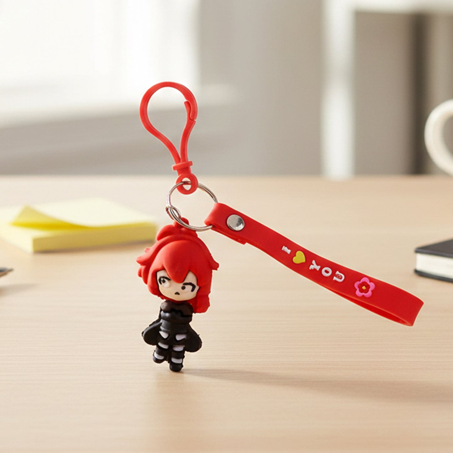 Cute red-haired cartoon girl silicone keychain featuring a cheerful expression, designed by Wukusy.