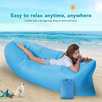 Wukusy inflatable air lounger sofa for outdoor camping, beach, and pool, shown fully inflated on grass with a person relaxing inside.