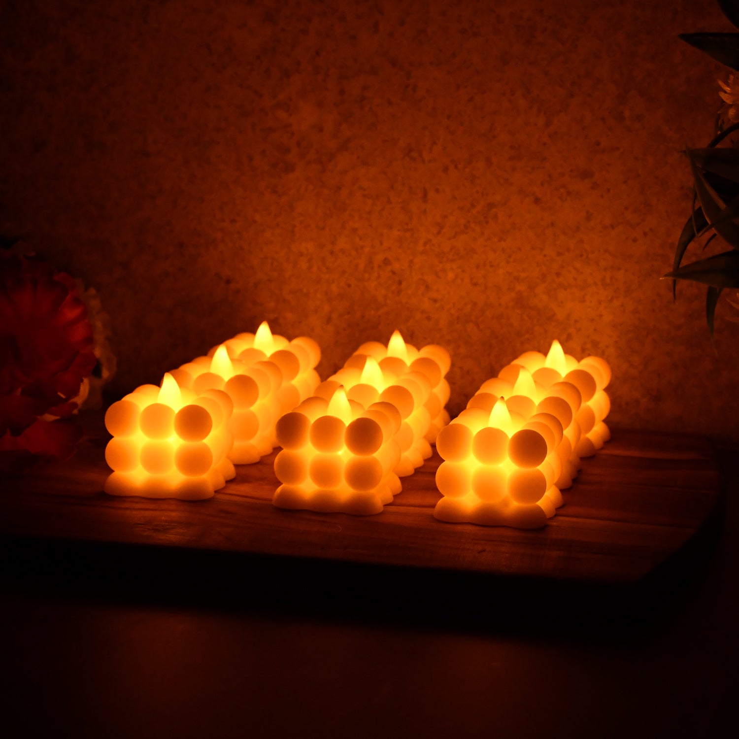 Set of nine decorative LED bubble candles by Wukusy, perfect for home decor with glowing, bubble-like candle designs.